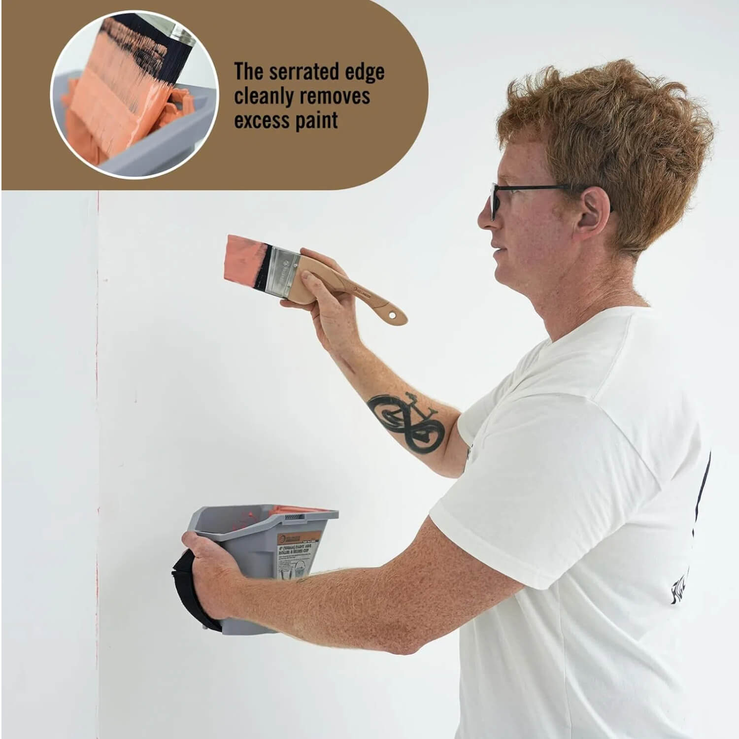 Handheld portable paint pail used while painting wall for convenient paint access